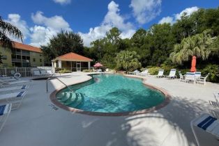 Low Rise (1-3), 9175 Celeste Dr # 306, Naples FL 34113